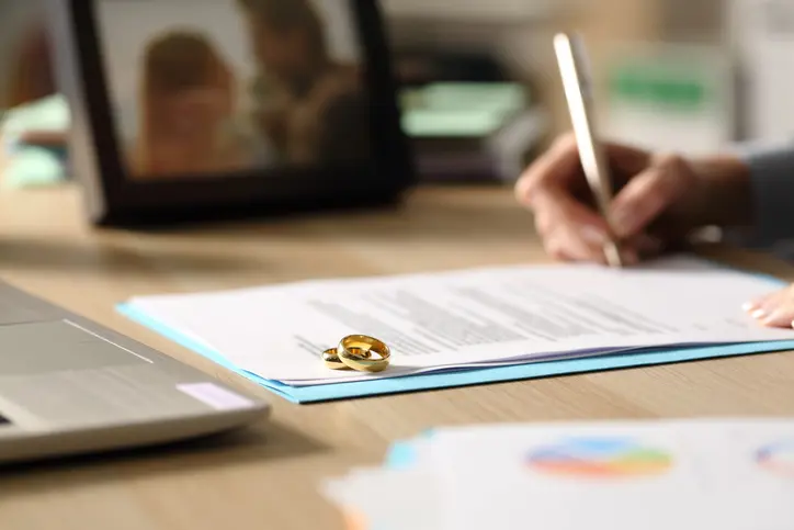 person signing divorce papers
